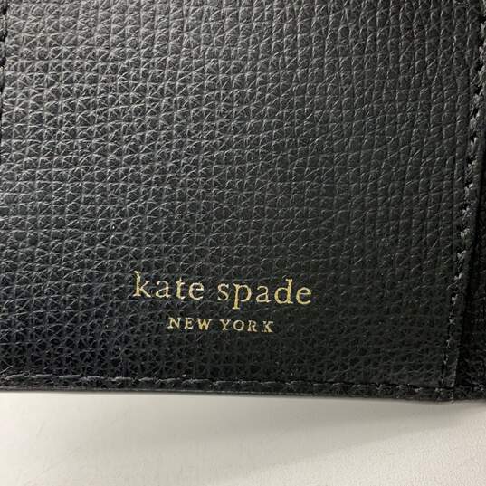 Kate Spade Womens Sylvia Black White Floral Perforated Slim Bifold Wallet image number 6