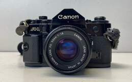 Canon A-1 SLR Camera w/ Accessories
