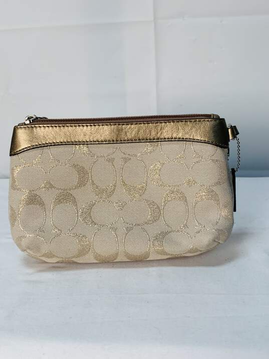 Tan/ Silver Coach Wristlet Certified Authentic Tan/ Silver Coach Wristlet Certified Authentic image number 2
