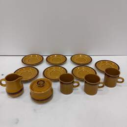Set of Brown Crest-Stone Clover Cups, Saucer and Other Dishes