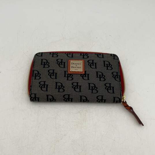 Dooney & Bourke Womens Brown Red Signature Print Inner Pockets Zip Around Wallet image number 1