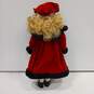 Unbranded Porcelain Doll With Blue Eyes, Curly Blonde Hair, Multicolor Plaid Dress, Red Coat And Hat, Black Shoes, And White Socks And Bloomers image number 2