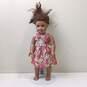 American Girl Doll With Brown Skin & Hair, Green Eyes, Curly Hair, And In Flower Dress image number 1