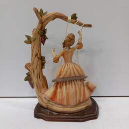 Vintage Lady on Swing Porcelain figure on Wooden Stand alternative image