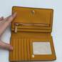 Michael Kors Womens Yellow Leather Credit Card Slots Zipper Pocket Bifold Wallet image number 4