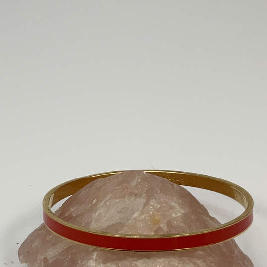Designer Kate Spade Gold-Tone Pink Enamel Round Shape Bangle Bracelet image number 1