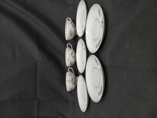 China Set of 4 White Teacups And 5 Saucers w/ Floral Pattern image number 1