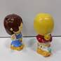 Pair Of Vintage Multicolor Enesco Sports Skwirts Coin Banks image number 3
