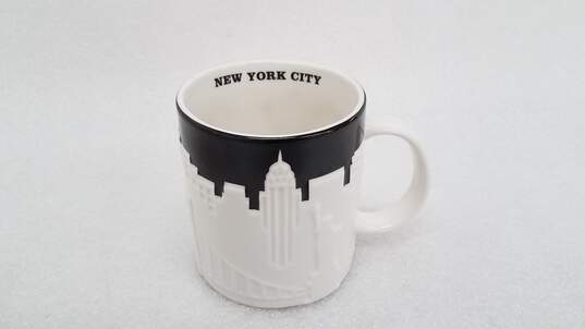 Starbucks New York City Relief Collection 16oz Mug Raised Skyline Taxi 2012 image number 1