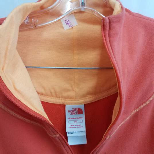 The North Face orange front zip track jacket women's L image number 3