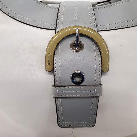 Moderate wear with some scuffs and scratches.  Coach Soho Lynn Soft White Leather Gray Trim Hobo Shoulder Bag image number 6