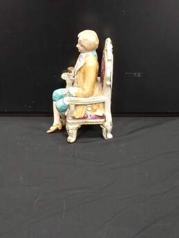 Vintage Hand Painted Porcelain Seated Man with Cup alternative image