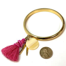 Designer J. Crew Gold Tone Pink Tassel Charm Beaded Classic Bangle Bracelet alternative image