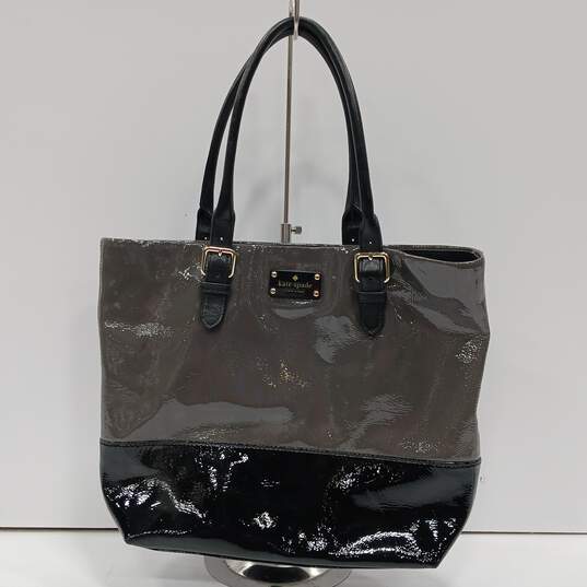 Buy the Kate Spade Grey & Black Glazed Patent Leather Magnetic Lock Tote Bag  | GoodwillFinds