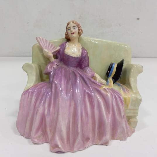 Vintage Signed Woman in Purple Dress & Hat on Sofa Figurine image number 1