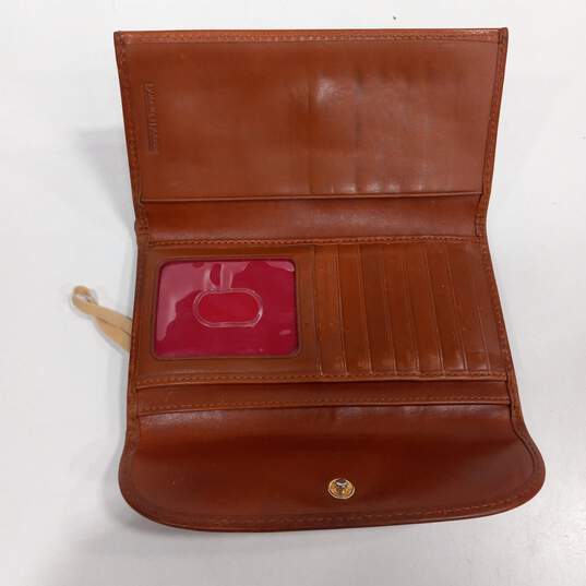 Dooney & Bourke Magenta Patent Leather Tri-Fold Wallet image number 2