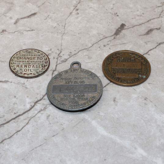 Three Vintage Gasoline and Motor Oil Promotional/Service Tokens & Tags image number 2