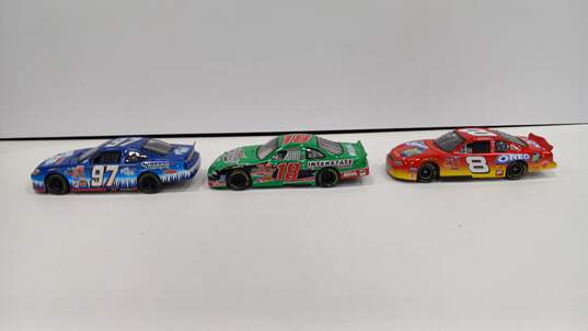 Bundle of 3 Assorted Action NASCAR Toy Cars image number 1