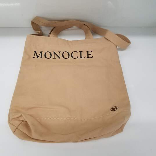 Buy the Monocle Canvas Tote Bag | GoodwillFinds