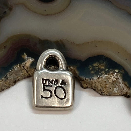 Designer Uno De 50 Silver Tone Sun Burst Purse Lock Charm Pendant image number 3