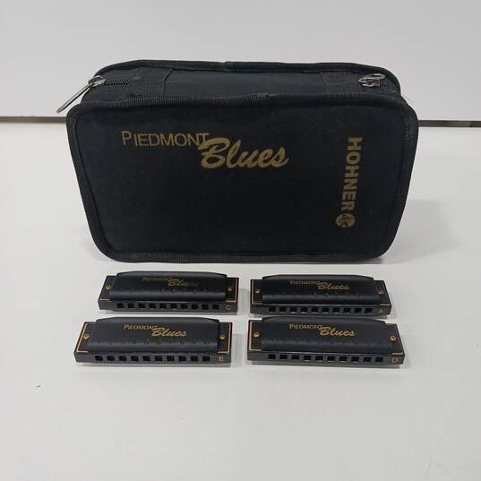 4 Vintage Piedmont Blues HOHNER Harmonicas in Case image number 1