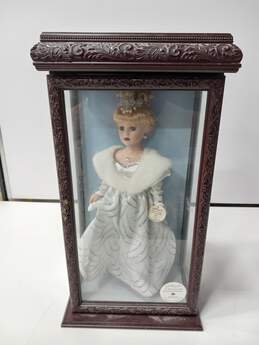 VINTAGE 2000 CAMELLIA GARDENS COLLECTION 16" PORCELAIN DOLL IN WOOD AND GLASS CASE WITH SWAROVSKI COMPANY NECKLACE AND EARRINGS