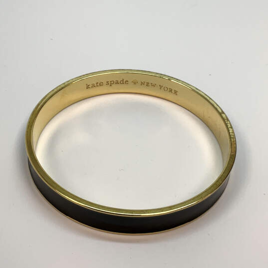 Designer Kate Spade Gold-Tone Black Enamel Round Shape Bangle Bracelet image number 4