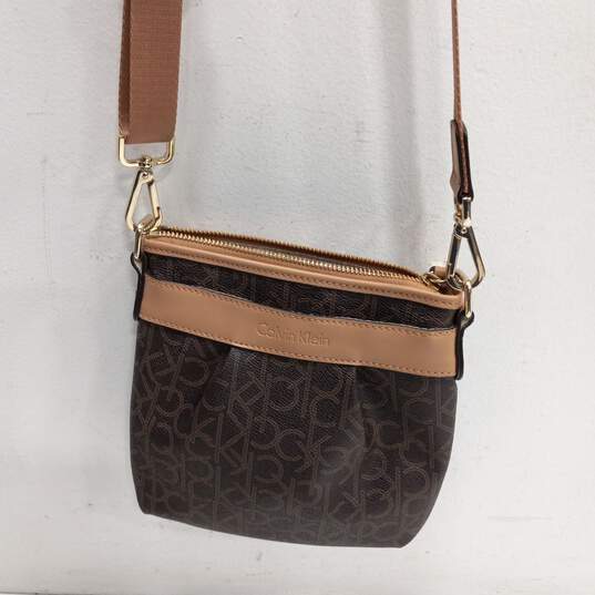 Buy the Calvin Klein Brown & Beige/Tan Monogram Crossbody Bag
