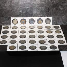 Assorted Lot of 38 Foreign Coins in Coin Slips