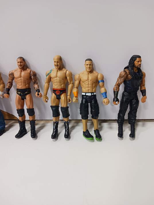 Lot of 8 Assorted WWE Wrestling Action Figures & Accessories image number 4