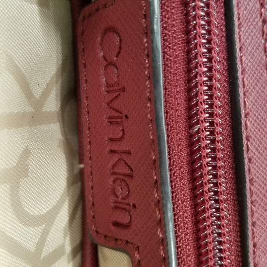 Buy the Calvin Klein Tan Brown & Red Backpack