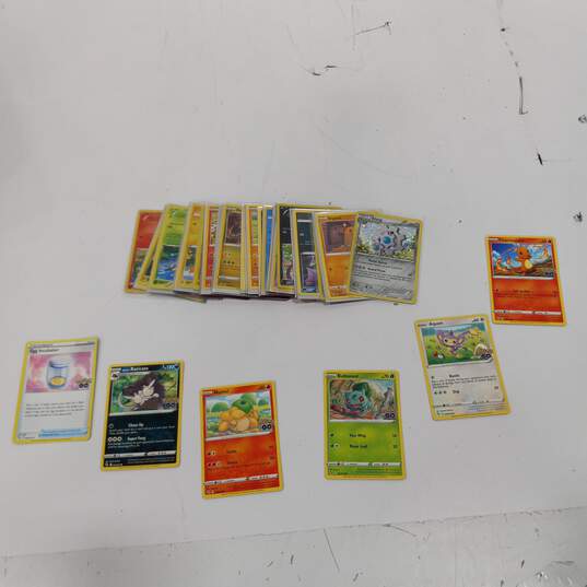Bundle of Assorted Nintendo Pokemon Trading Cards In Tin Case image number 4