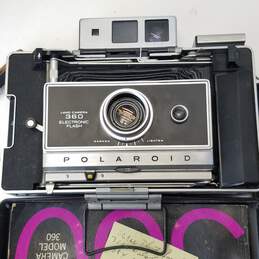 Lot of 2 Assorted Vintage Polaroid Instant Cameras and Accessories alternative image