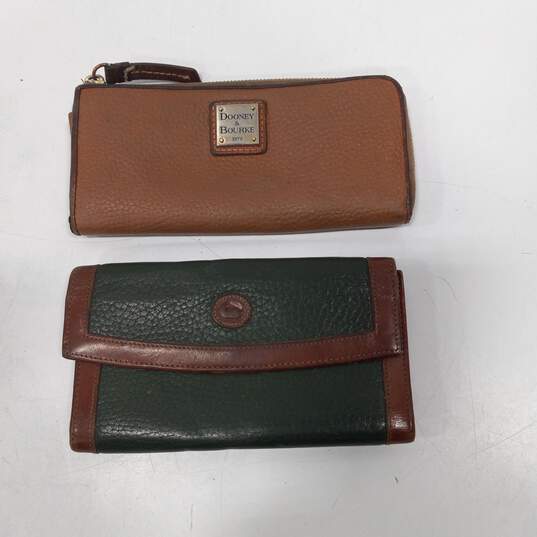 Pair of Dooney and Bourke Leather Unisex Wallets image number 1