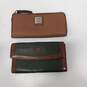 Pair of Dooney and Bourke Leather Unisex Wallets image number 1