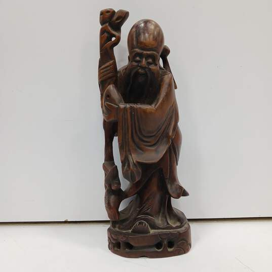 Hand-Carved Wooden Figurine image number 1