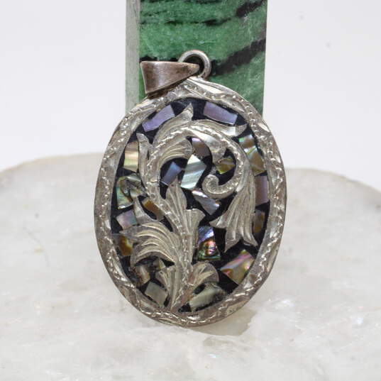 Artisan Signed Sterling Silver Pendant with Abalone Shell Fragments image number 1