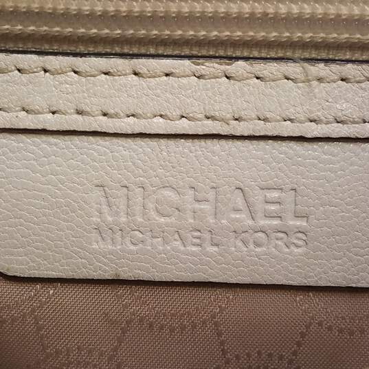 Buy the Michael Kors Leather Metal Handle Clutch Crossbody White