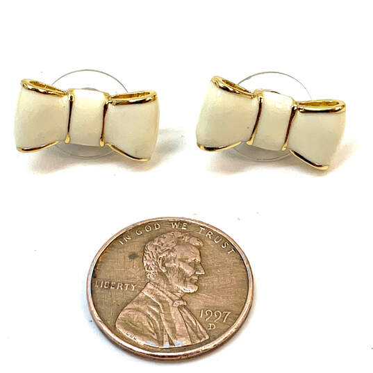 Designer Kate Spade Gold-Tone White Enamel Bow Shape Stud Earrings image number 2