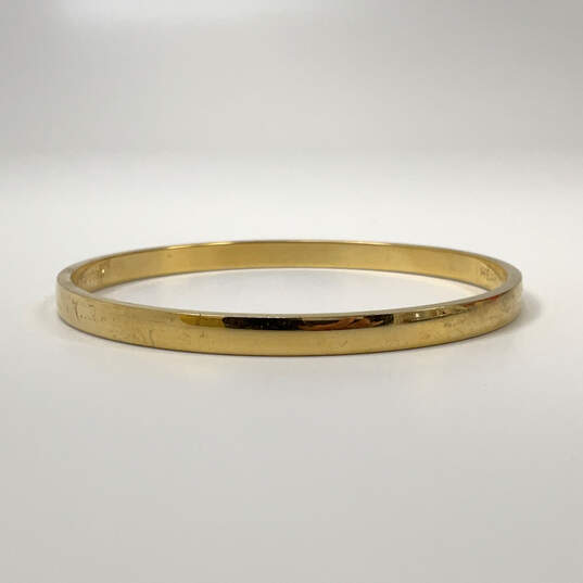 Designer Kate Spade New York Gold-Tone Round Shaped Bangle Bracelet image number 2
