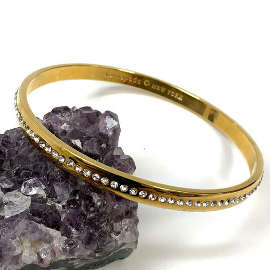 Designer Kate Spade Gold-Tone Clear Rhinestone Studded Bangle Bracelet image number 1