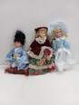 Bundle of 3 Assorted American & Japanese Themed Porcelain Dolls w/ Two Stands image number 1
