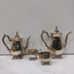 Bundle of 2 Oneida Silver Colored Teapots With Lids And Creamer And Sugar Bowls