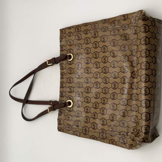 Michael Kors Womens Brown Leather Signature Print Zipper Pocket Tote Bag Purse image number 1