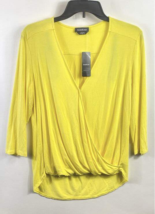 Buy the Bebe Women Yellow Long Sleeve Drape Blouse M | GoodwillFinds