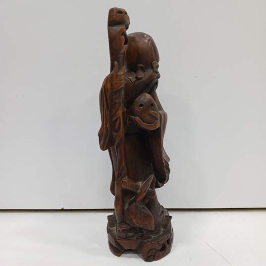 Hand-Carved Wooden Figurine image number 3