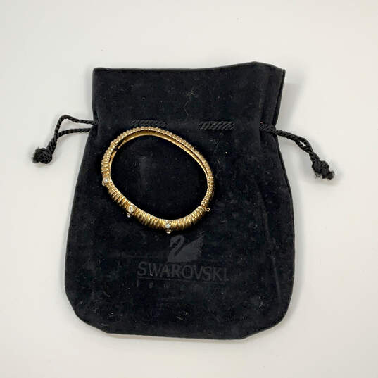 Designer Swarovski Gold-Tone Rhinestone Hinged Bangle Bracelet w/ Dust Bag image number 4