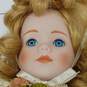 Dynasty Doll Collection Porcelain (Music Box Inside) Doll With Blonde Curly Hair, Blue Eyes, And Yellow Outfit image number 3