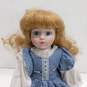 Dynasty Doll Collection Porcelain Doll With Curly Blonde Hair And Blue Eyes In Blue And White Dress image number 2