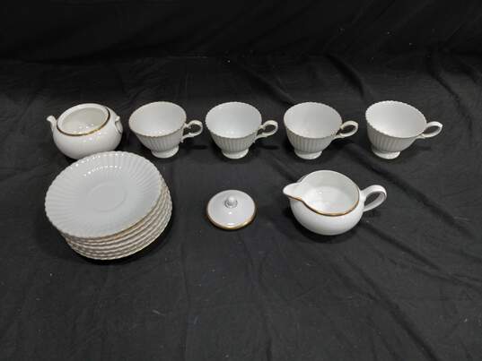 Bundle of 7 Wedgwood Bone China Plates w/ 4 Matching Tea Cups, Cream and Sugar Dish image number 1